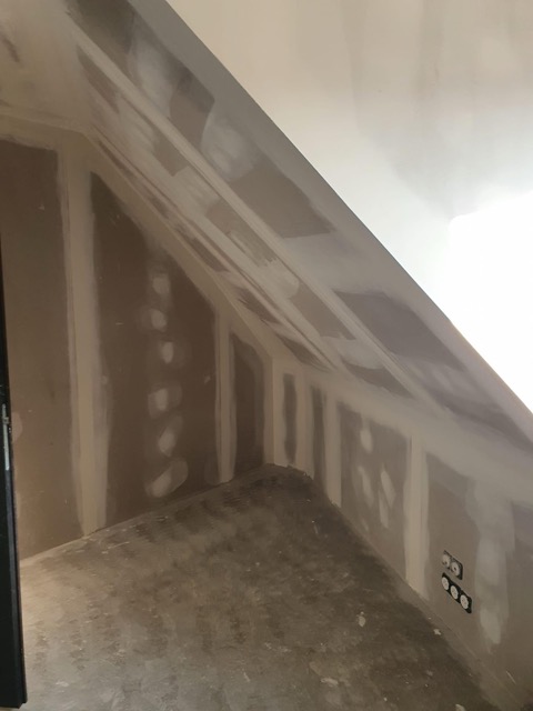 travaux d'un mur sous pente